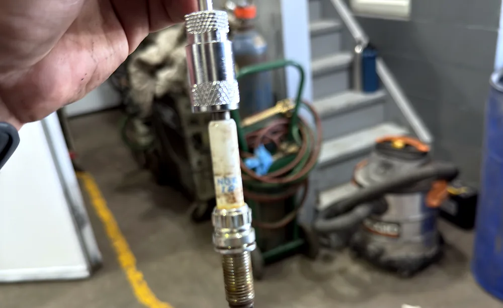 Worn spark plug removed from an engine during a tune up at Sultan Motors in Brampton