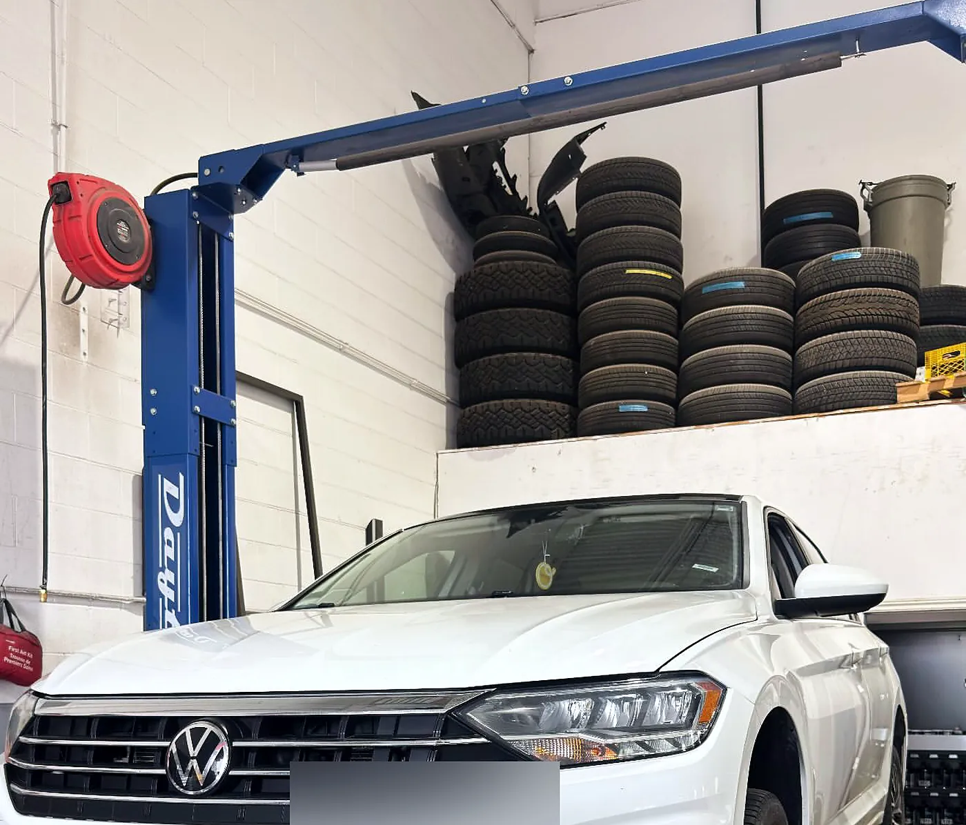 Volkswagen Jetta raised on a hoist at Sultan Motors for an Ontario safety standards inspection